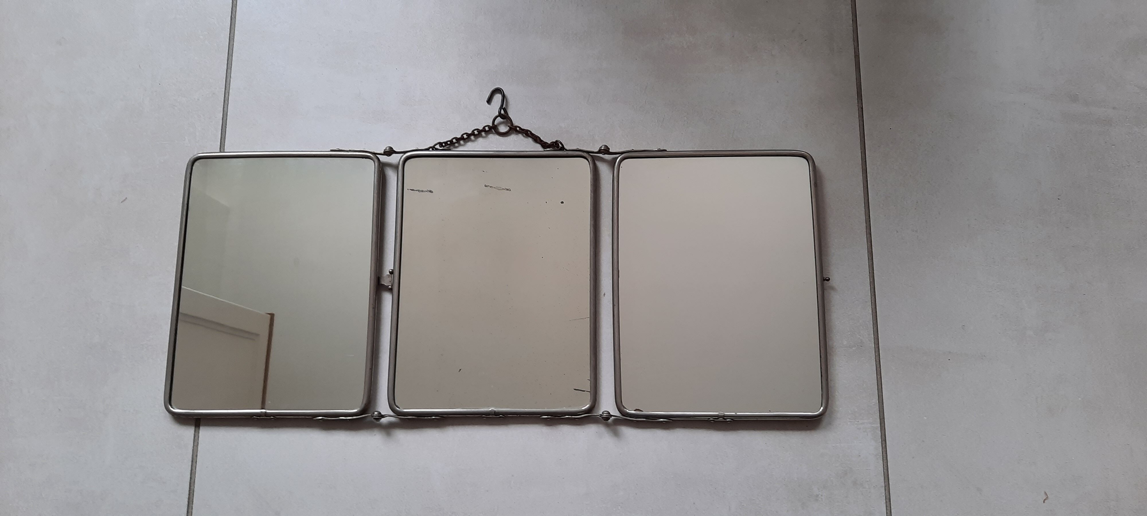 Ancient tryptic barber mirror