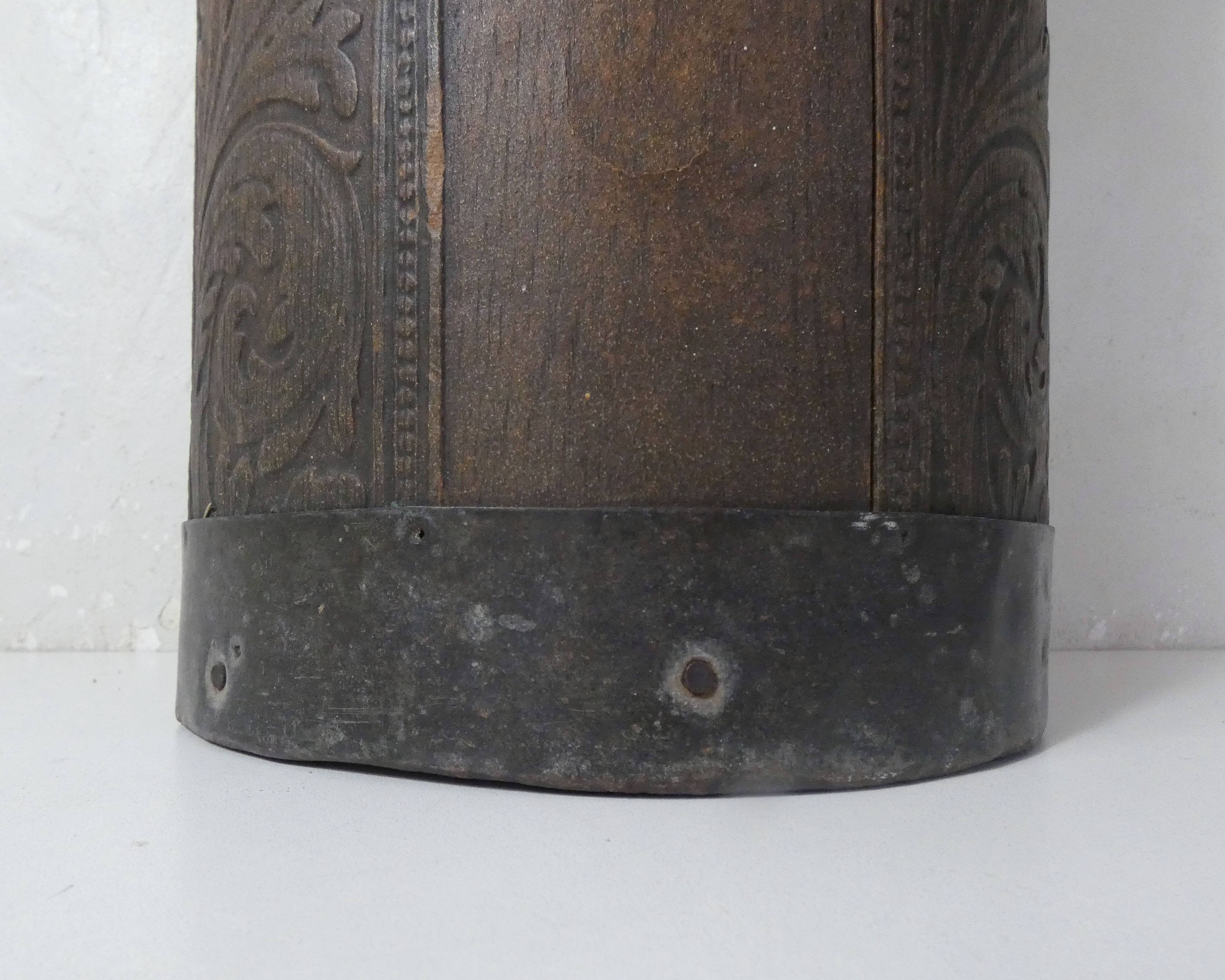 old carved wooden umbrella stand