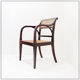 Mid-century curved wooden chairs with cane seats and backs.