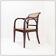 Mid-century curved wooden chairs with cane seats and backs.