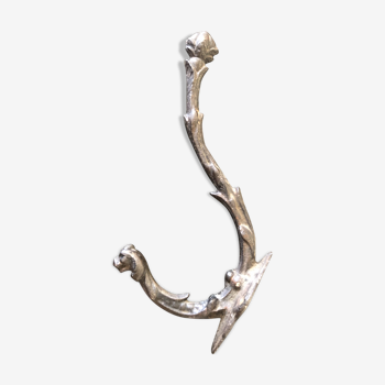 Ancient cast iron patère with chiseled animal head hook