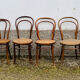 Set of 10 bentwood bistro chairs with cane seat.