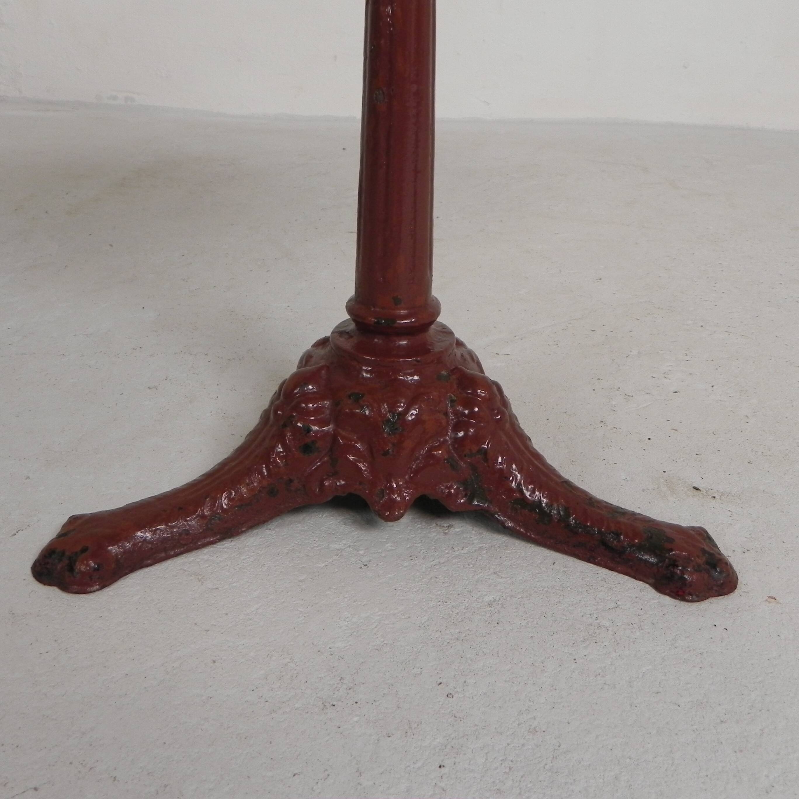 Bistro table with cast iron legs and marble top, 1920s.