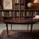 Oval Louis XVI style table with half-moon extensions.