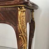 Console transforming into a 19th century Louis XV style gaming table