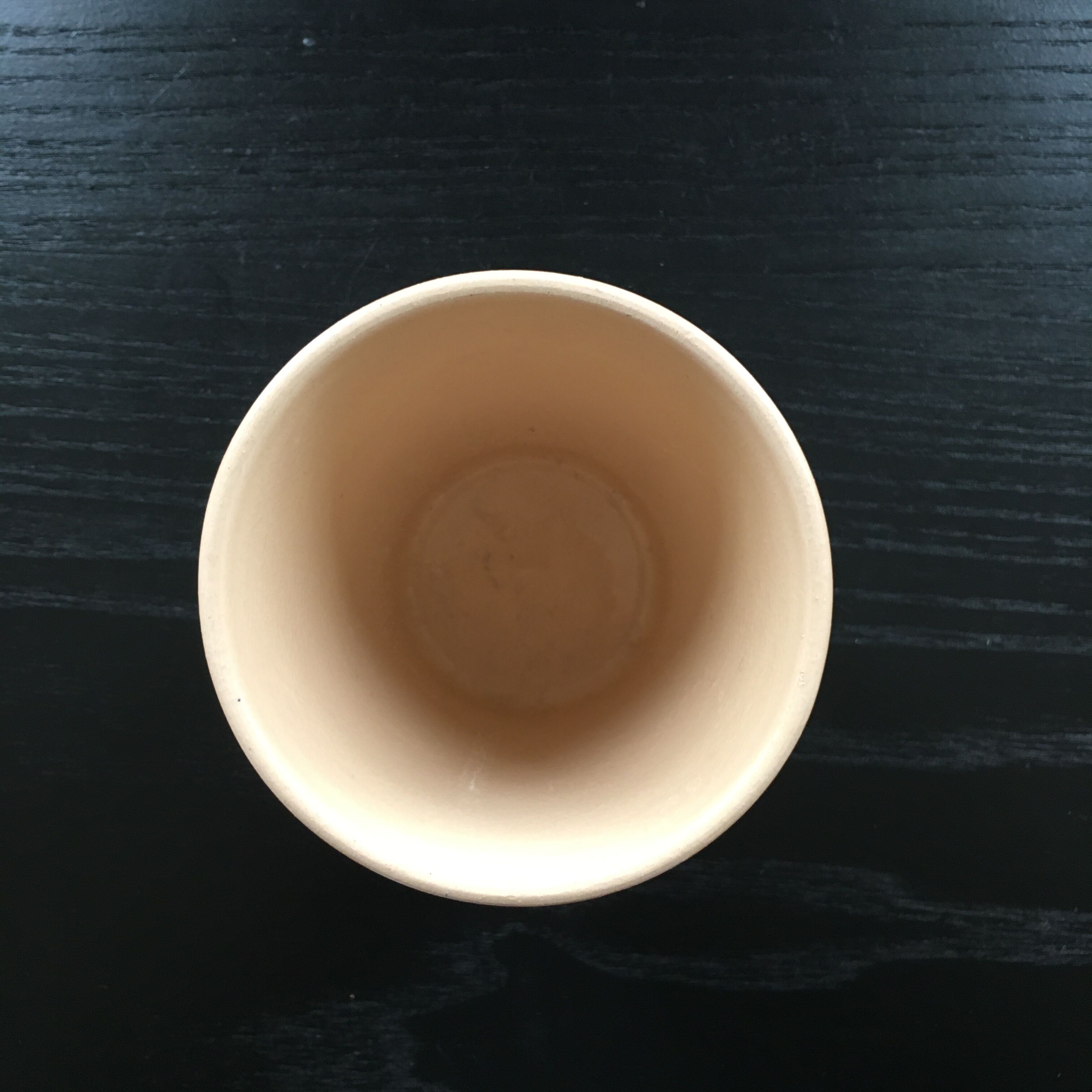 Ceramic cup with a signed decoration