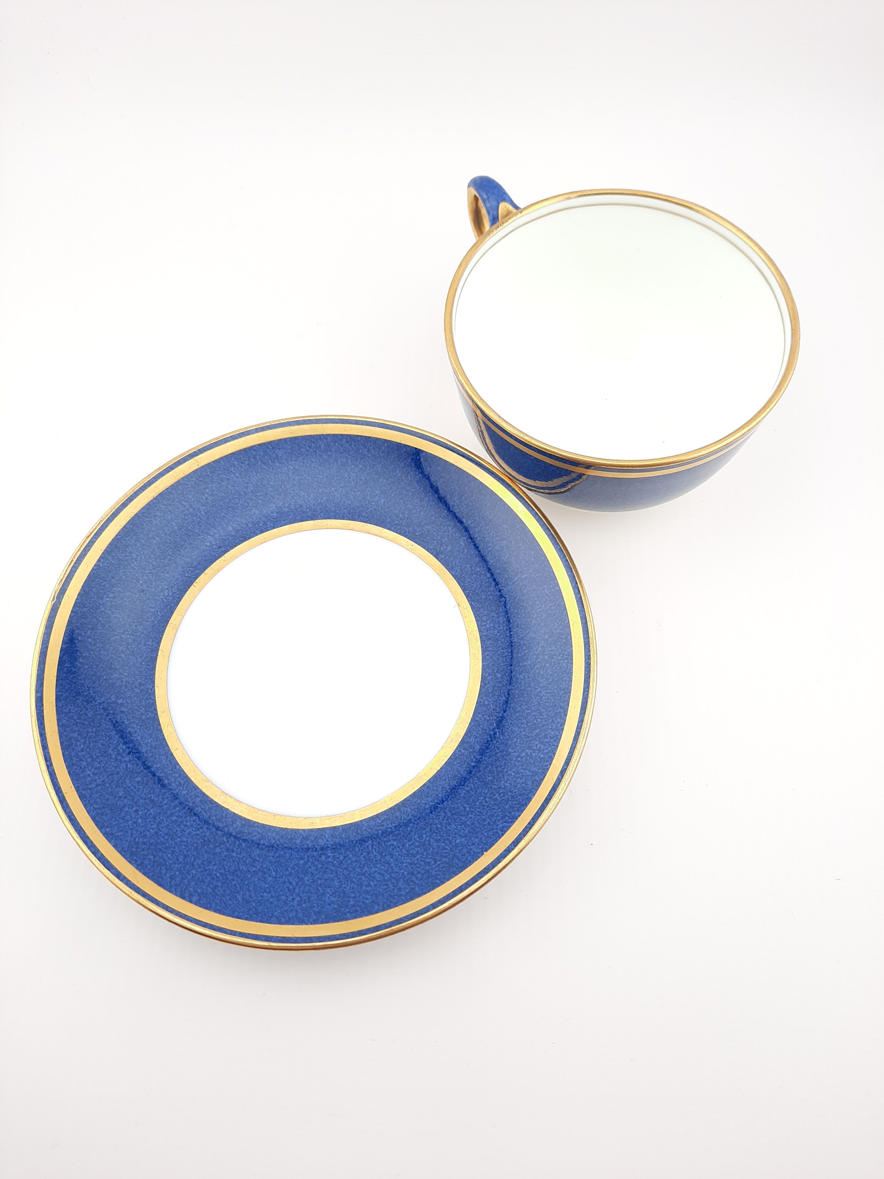 Antique Wedgwood teacup and saucer, bone china. Powder blue and gold English cup and saucer, 1900s