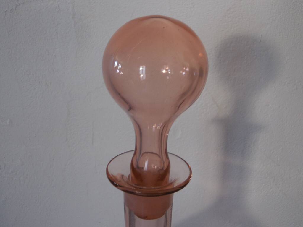 Pink transparent glass carafe with bubble cap