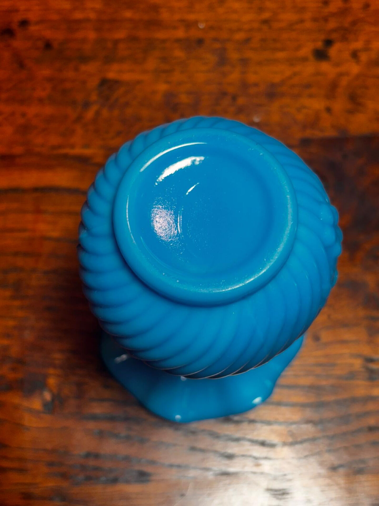 Blue opaline vase, opaque glass, wavy neck/rim, relief decoration of a bow.