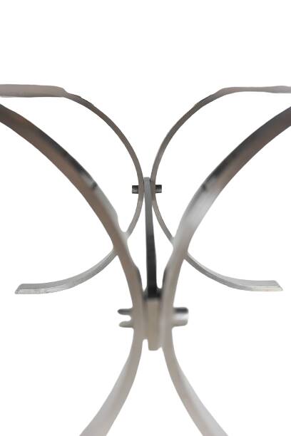 Polished metal and ceramic dining table. 1970s.