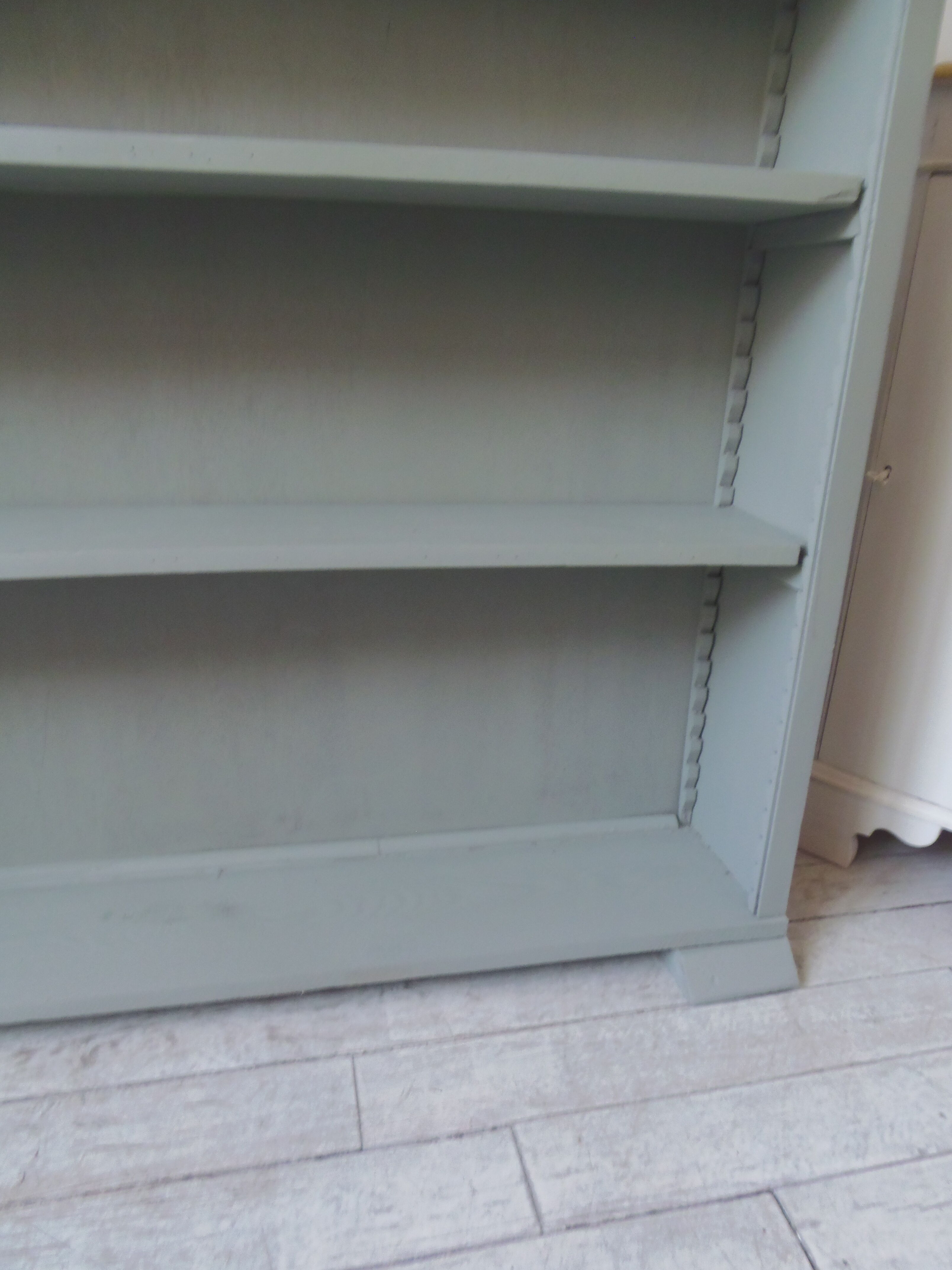 Vintage shallow bookcase, re-enchanted in gray green, wooden tray.