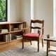 Antique Restoration-style armchair in walnut, fabric, Italy, 19th century.