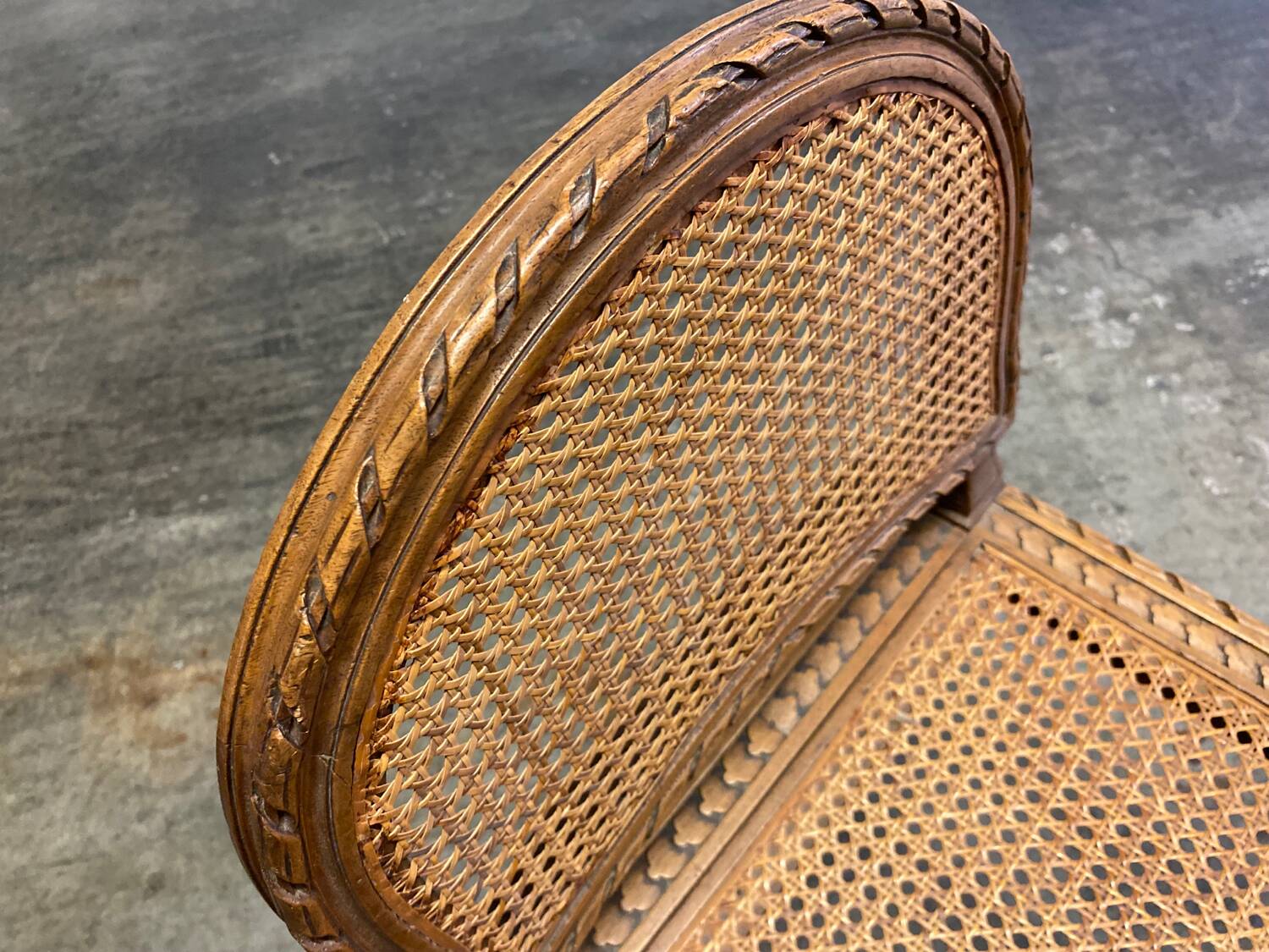 Wooden and cane bench (piano bench)