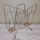 Vintage magazine holder in gilded brass.