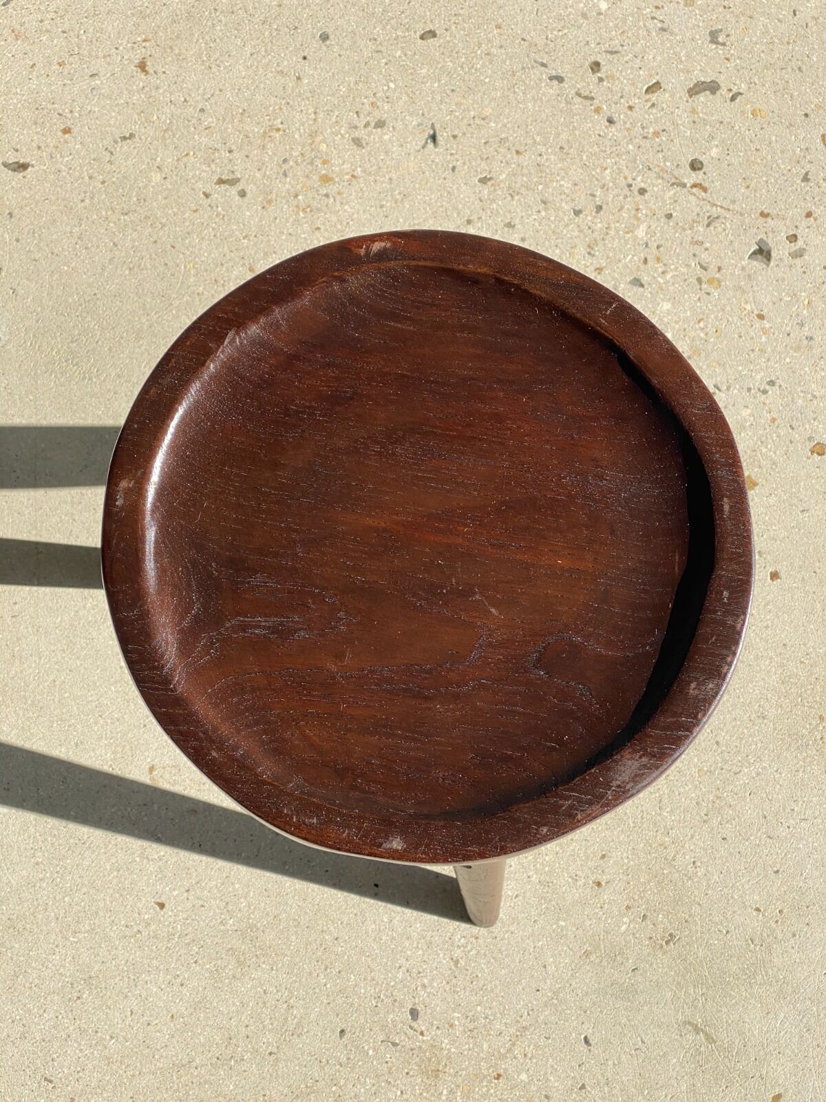 Brown solid wood stool seated circular dug