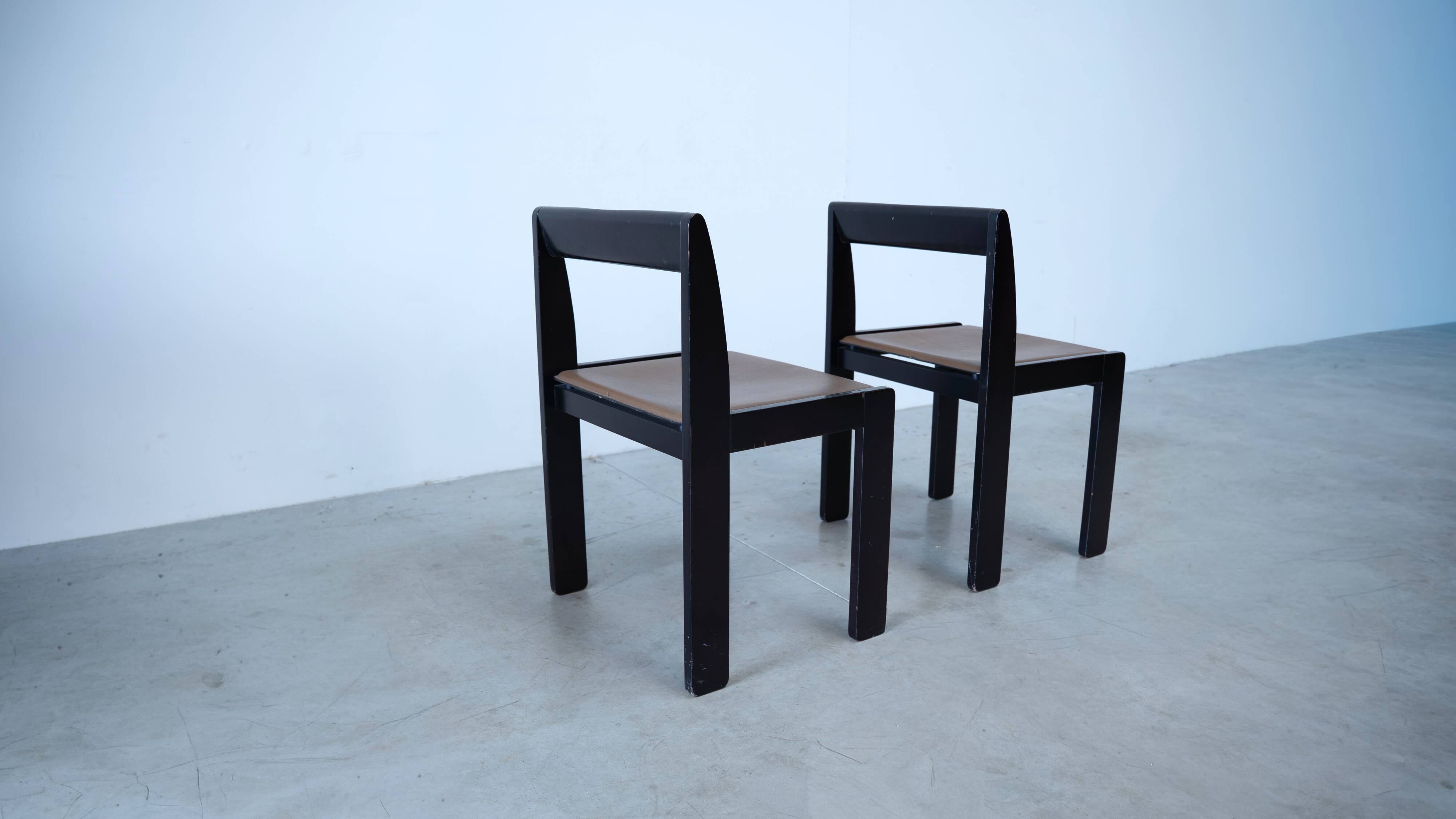 Set of eight black lacquered dining chairs