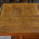 Solid oak table with central pedestal base and storage, Charles Dudouyt, 1950s