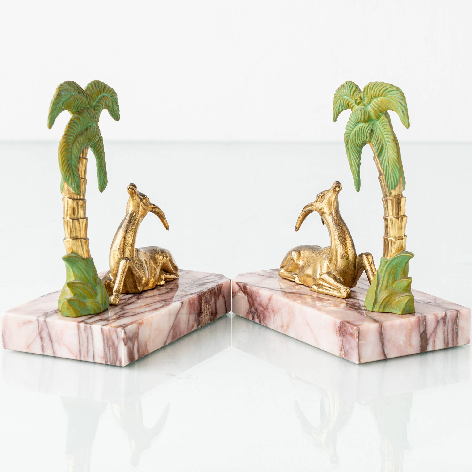 Pair of Art Deco Bookends in Pink Breccia Marble with Antelope and Palm Tree