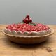 A trompe l’oeil strawberry pie dish