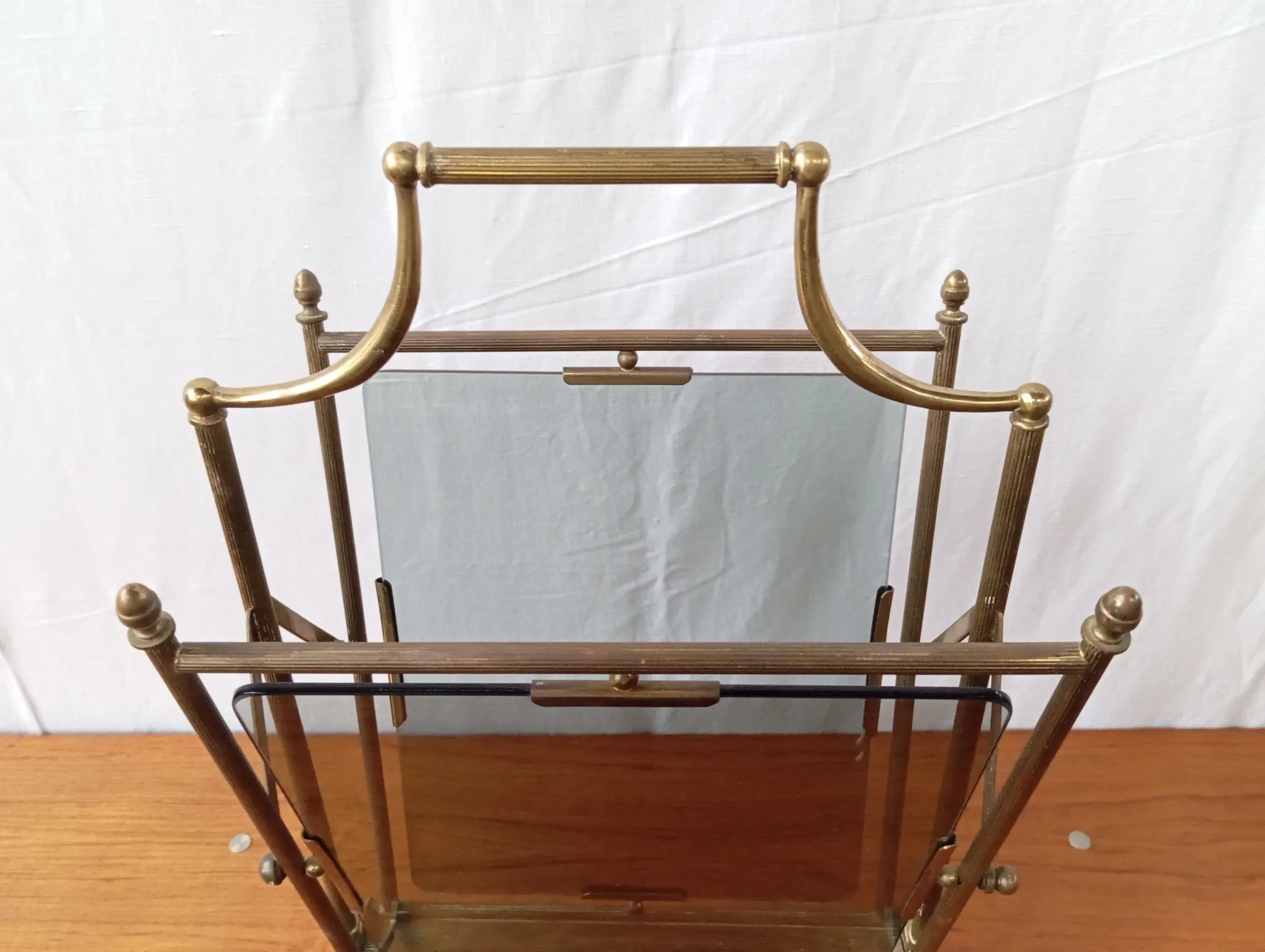 Neo-classical brass magazine rack in the spirit of Maison Jansen.