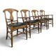 Serie de 4 fauteuils de style directoire à dossier en palmette