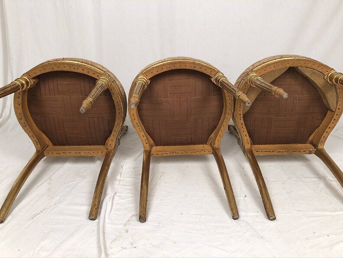 Series of three Louis XVI style chairs in gilded wood, circa 1900