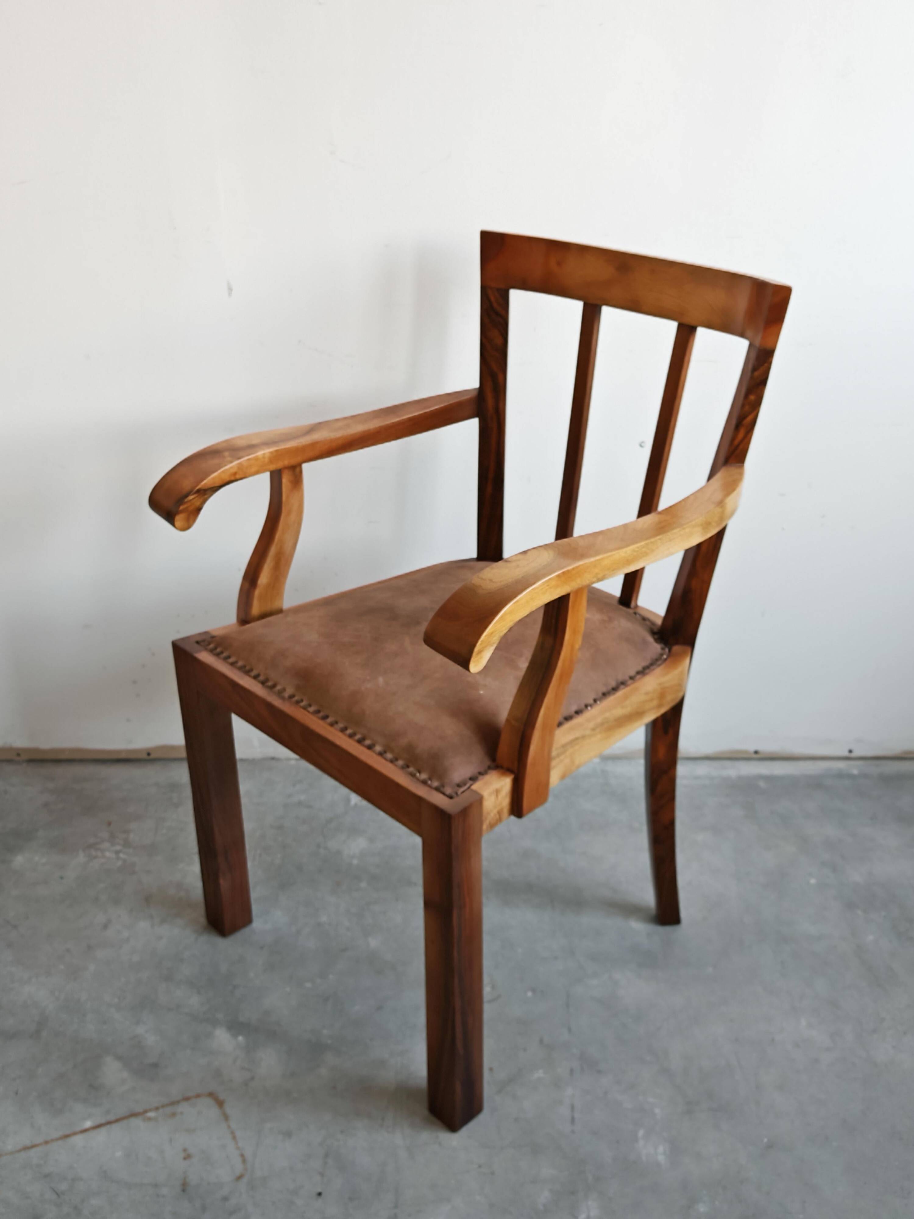 Pair of Art Deco armchairs in solid walnut and leather, 1920s
