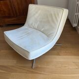 Two armchairs and a pop footstool from Roset