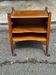 Vintage bedside table on wheels made of solid wood from the 1950s.