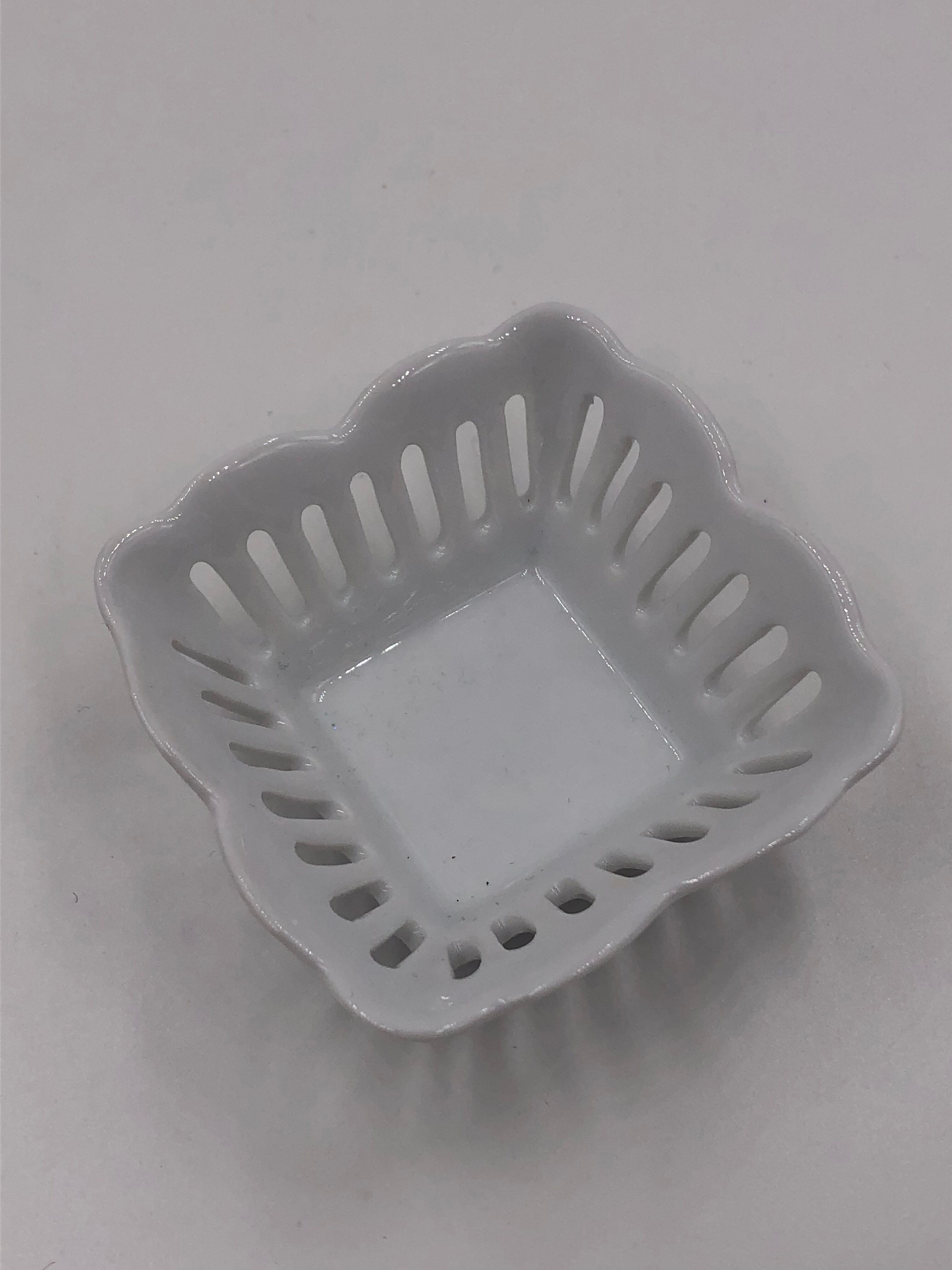 Empty vintage openwork porcelain pocket