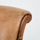 Vintage sheepskin armchair with a beautiful light colour and elegant legs