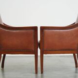 Ensemble majestueux et luxueux de 2 fauteuils design Art Déco en cuir de vachette couleur cognac