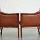 Majestic, luxurious set of 2 cognac-colored cowhide leather Art Deco design armchairs