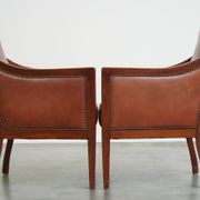 Majestic, luxurious set of 2 cognac-colored cowhide leather Art Deco design armchairs