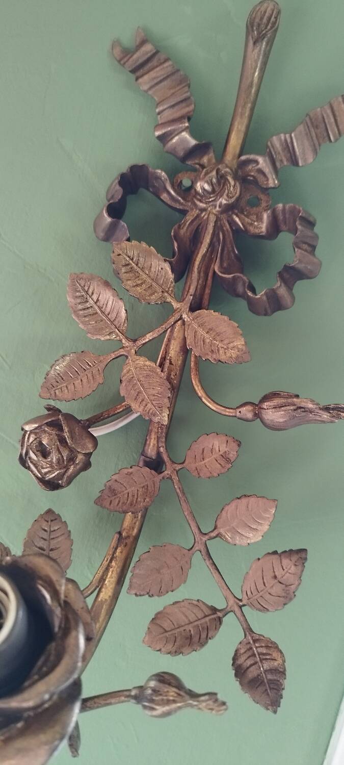 Bronze and gilded metal wall sconce in Louis XVI style.
