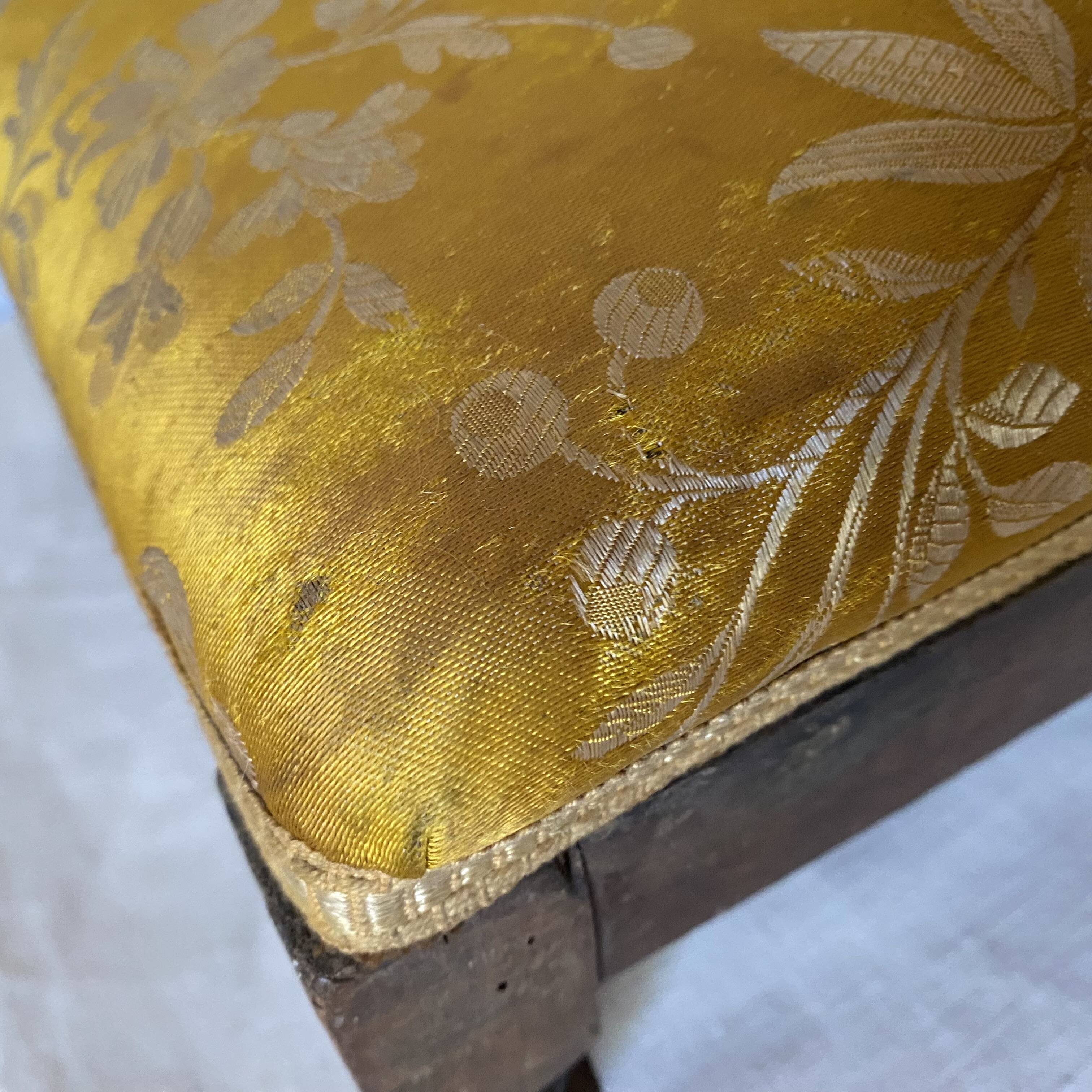 Low stool with antique wood and fabric footrest