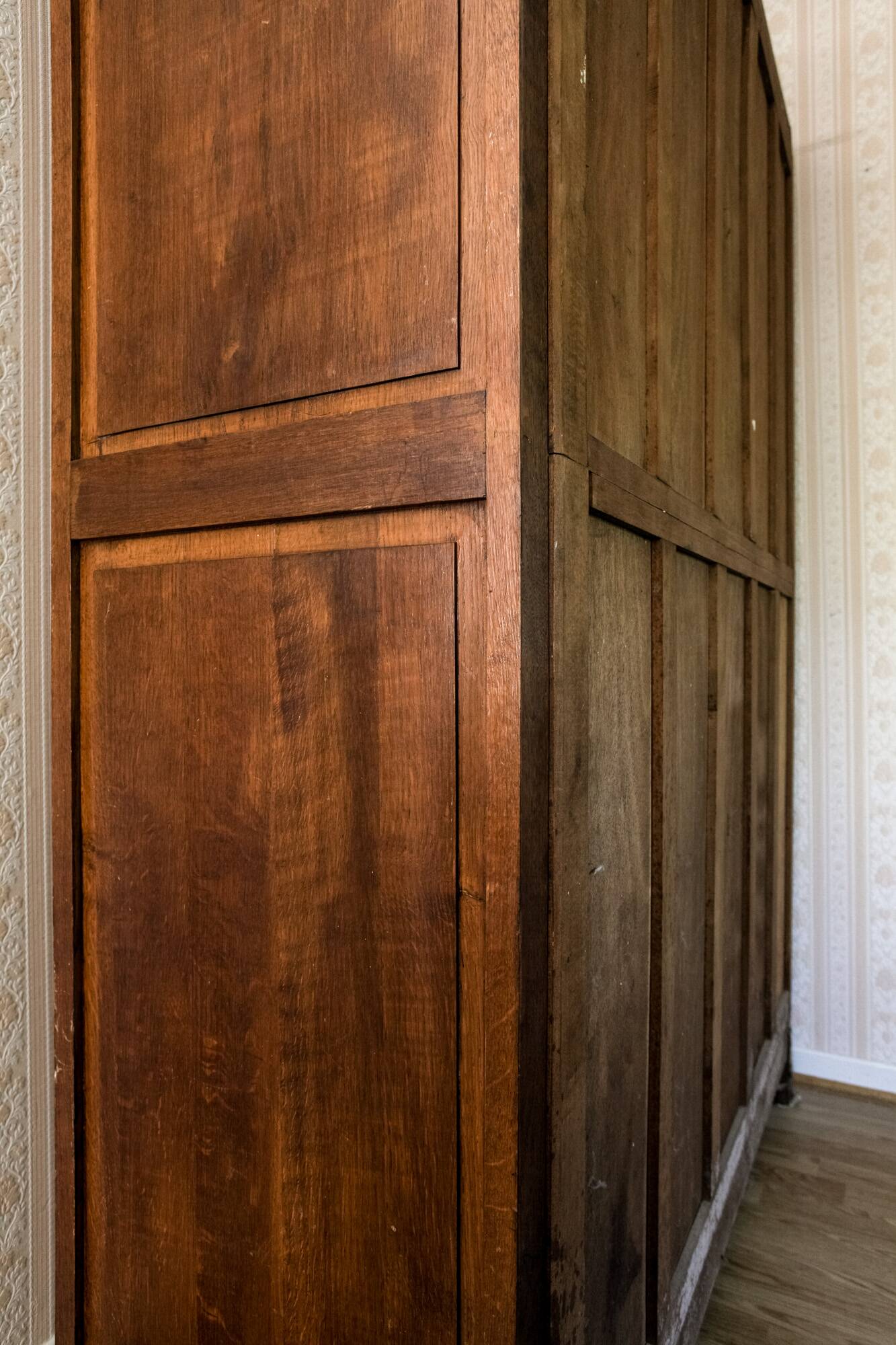 Old solid wood wardrobe with three vintage mirror doors