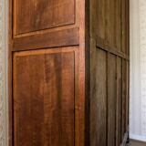 Old solid wood wardrobe with three vintage mirror doors