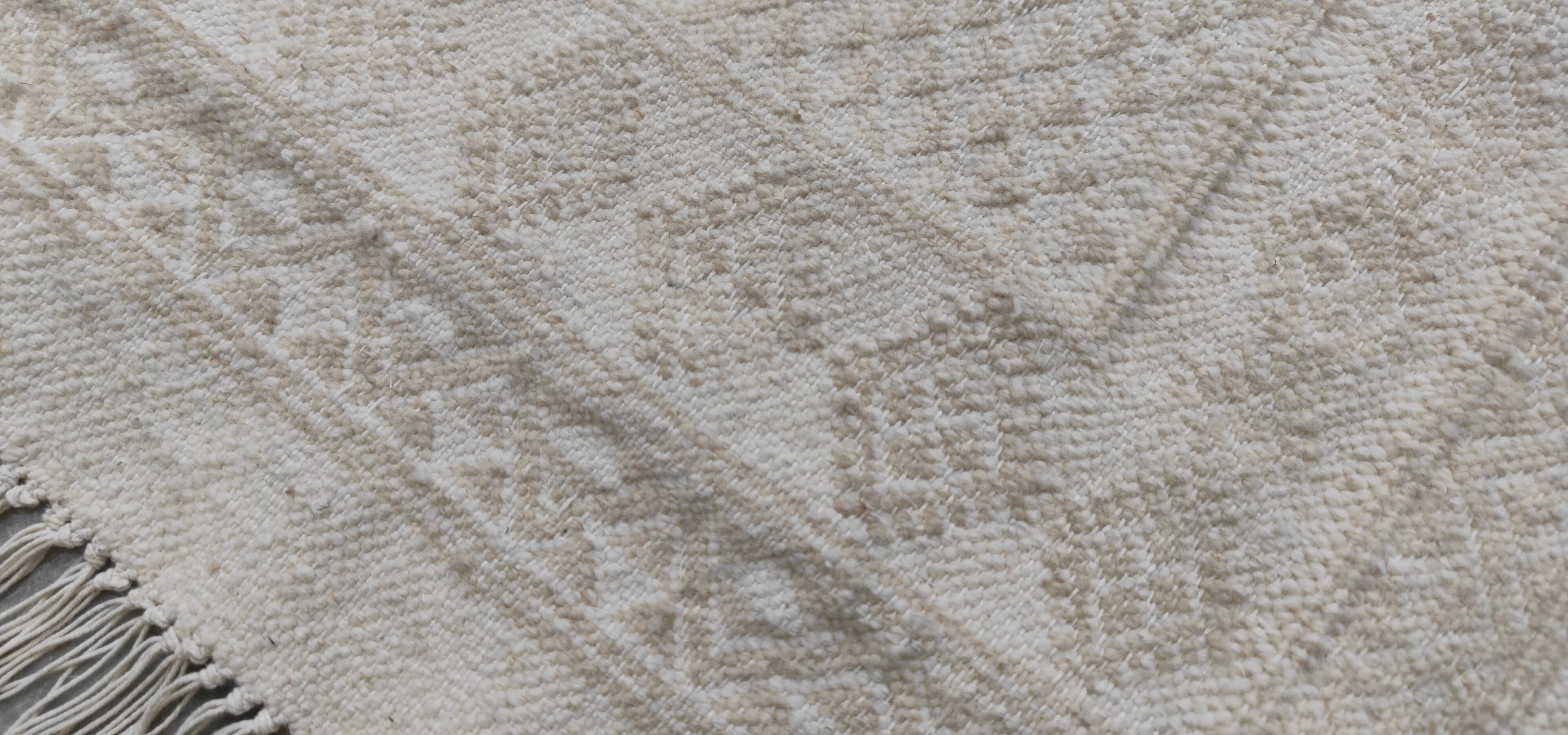 Hand-woven rug in natural wool