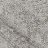Hand-woven rug in natural wool
