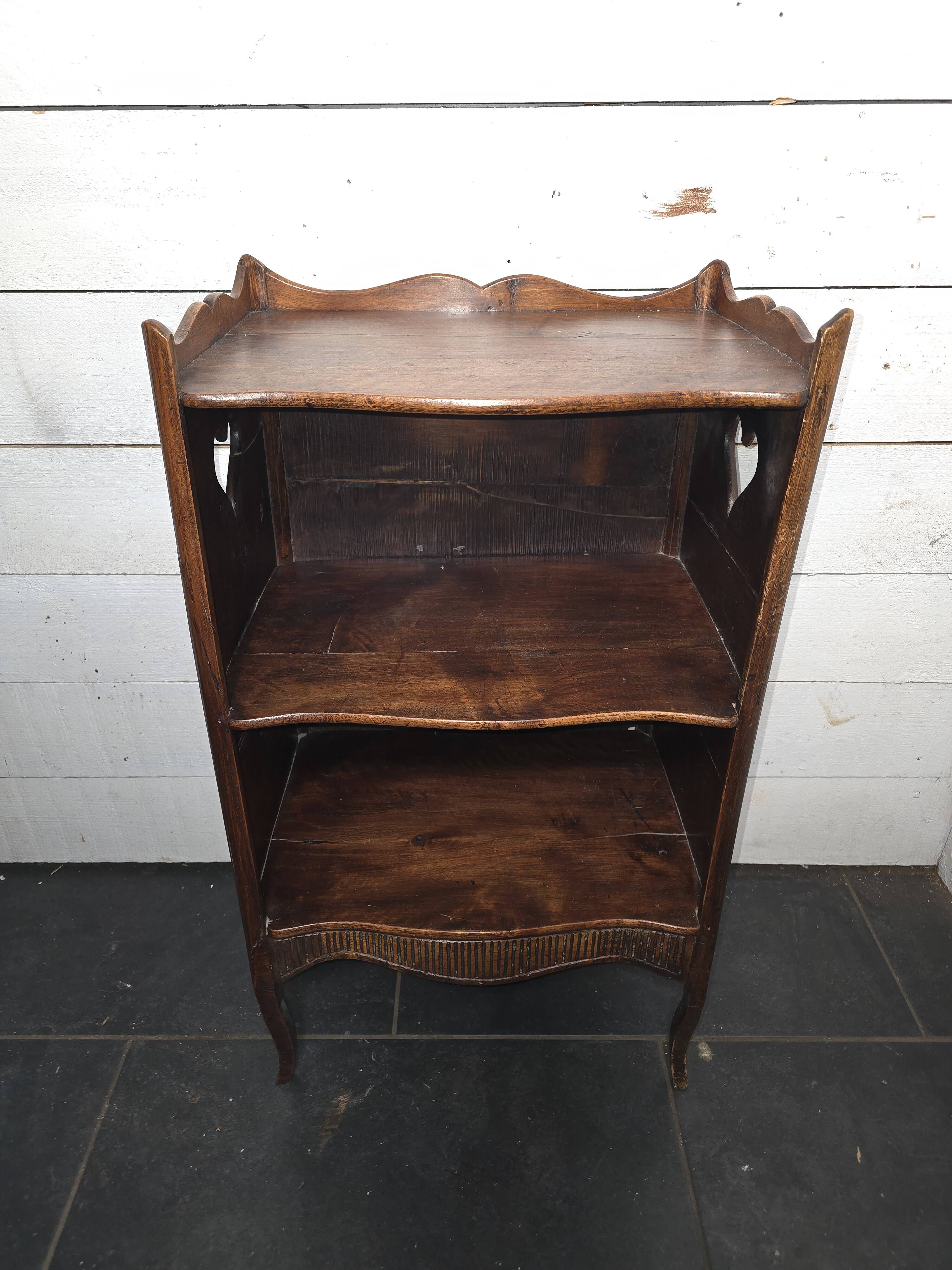 Open library in Louis XV style made of walnut.