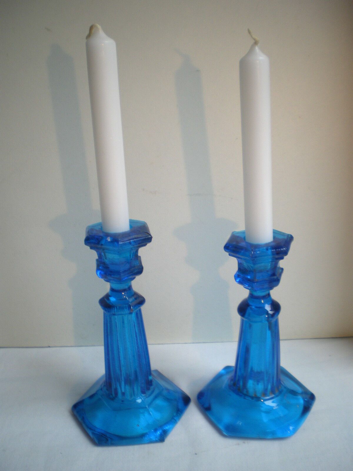 2 blue glass doll candlesticks