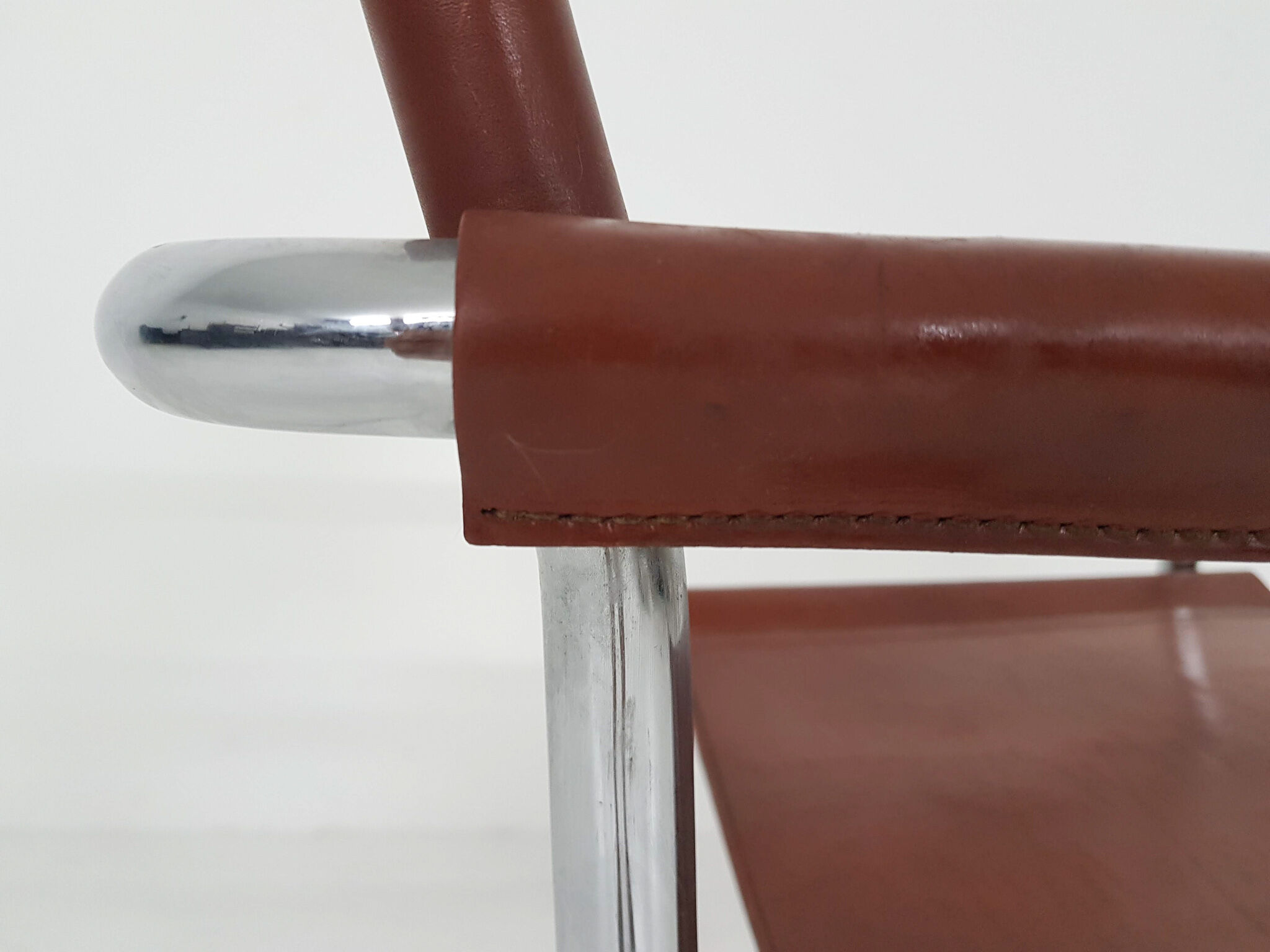 Tubular dining chair with arm rests, 1970's
