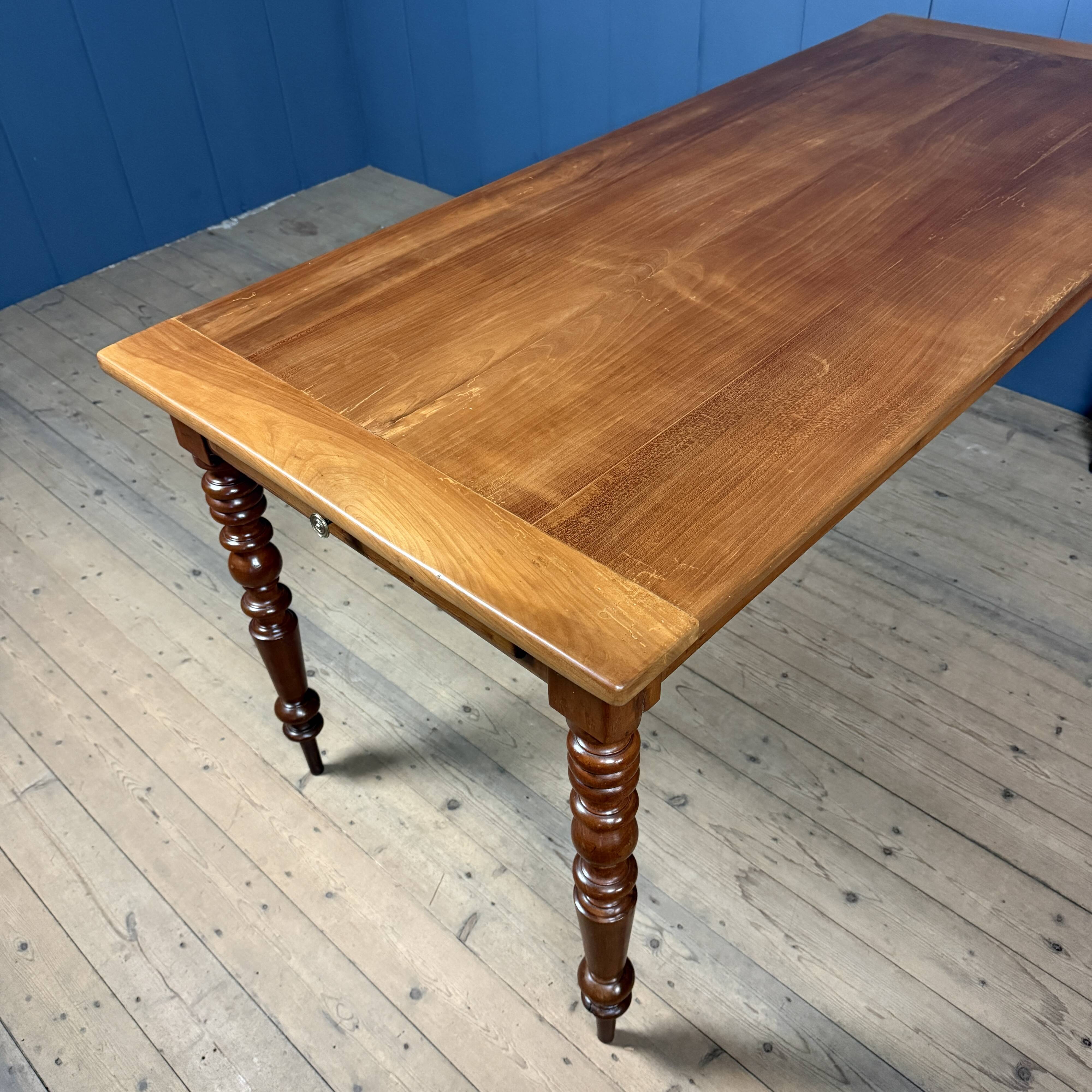 Antique cherry wood dining table from France.