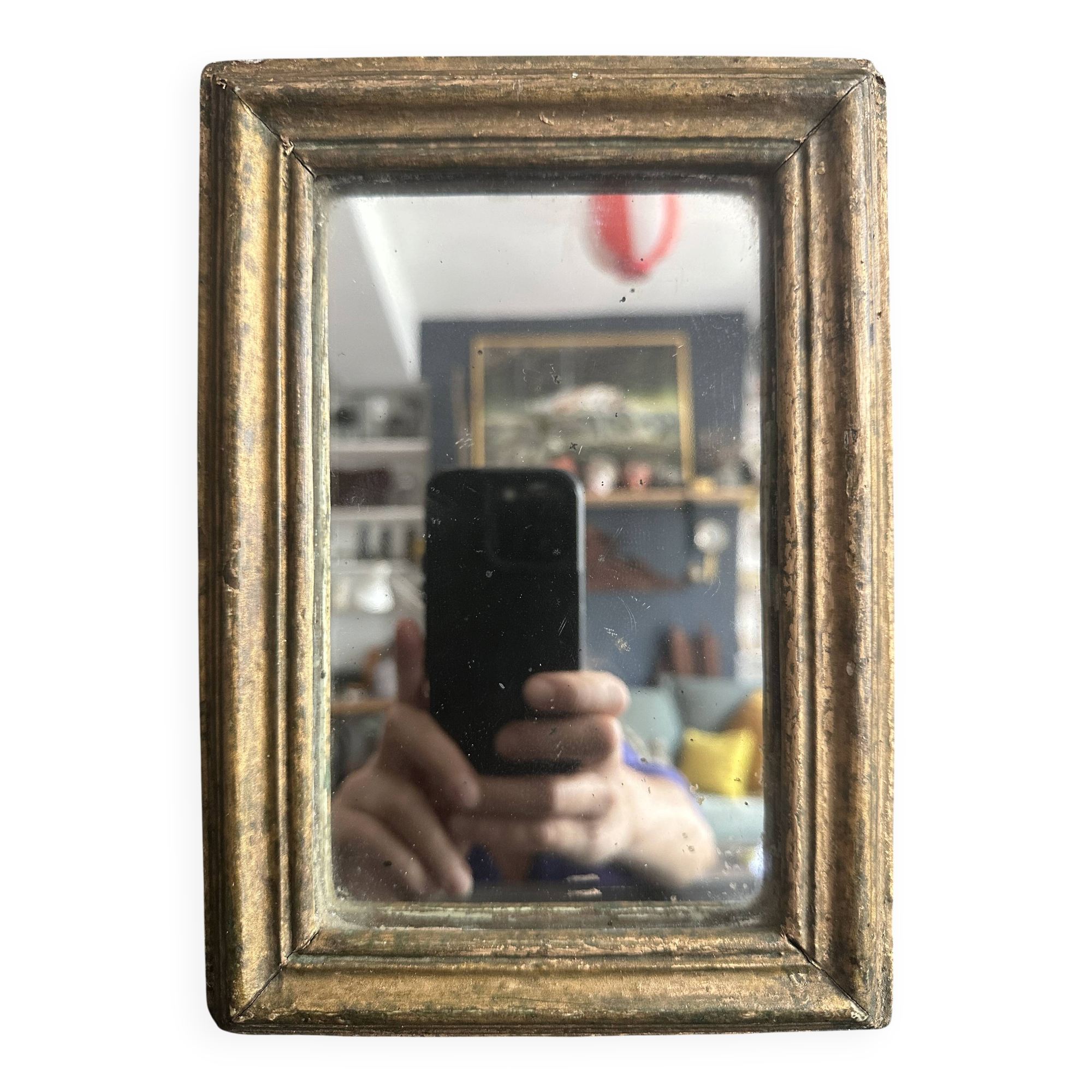 Miniature mirror from the 18th century in gilded wood, mercury glass.