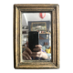 Miniature mirror from the 18th century in gilded wood, mercury glass.