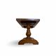 A small, rustic walnut wooden table, crafted from solid walnut wood, 1