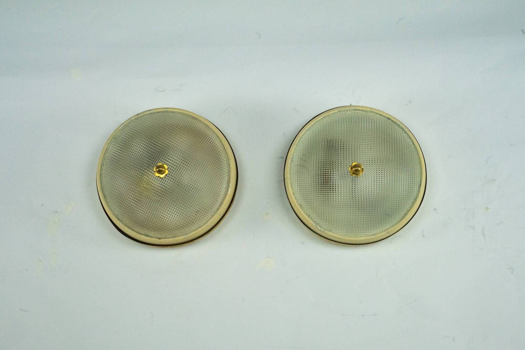 Lumi Milano, pair of wall or ceiling lamps in glass, brass and lacquer, 50s