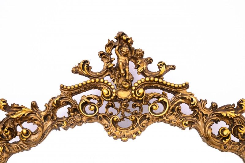 A large mirror in a gold frame, Italy, first half of the 20th century.