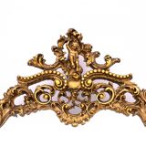 A large mirror in a gold frame, Italy, first half of the 20th century.